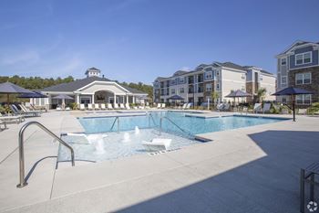 Resort-style, zero-entry pool with expansive sundeck
